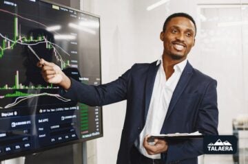 A businessman showing a financial chart, emphasizing the importance of Business English for presentations.