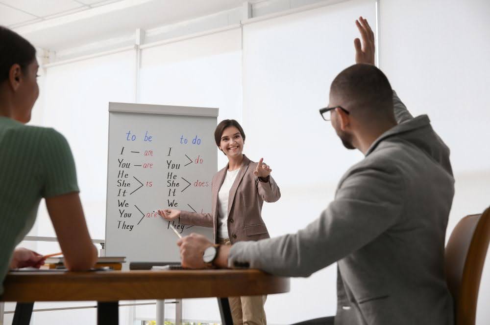 A young woman teaches a business language course