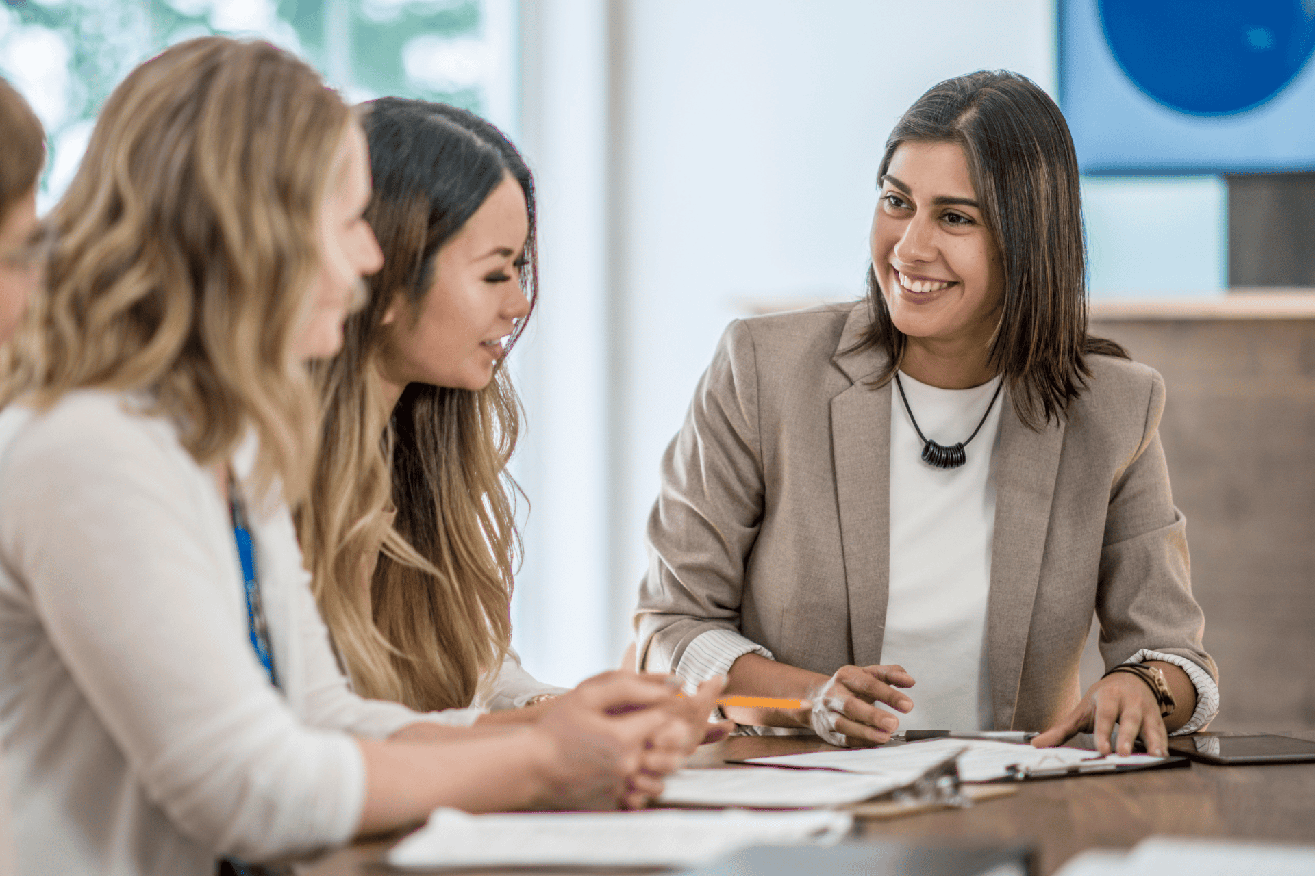 A manager and two employees engage in better communication by listening with empathy