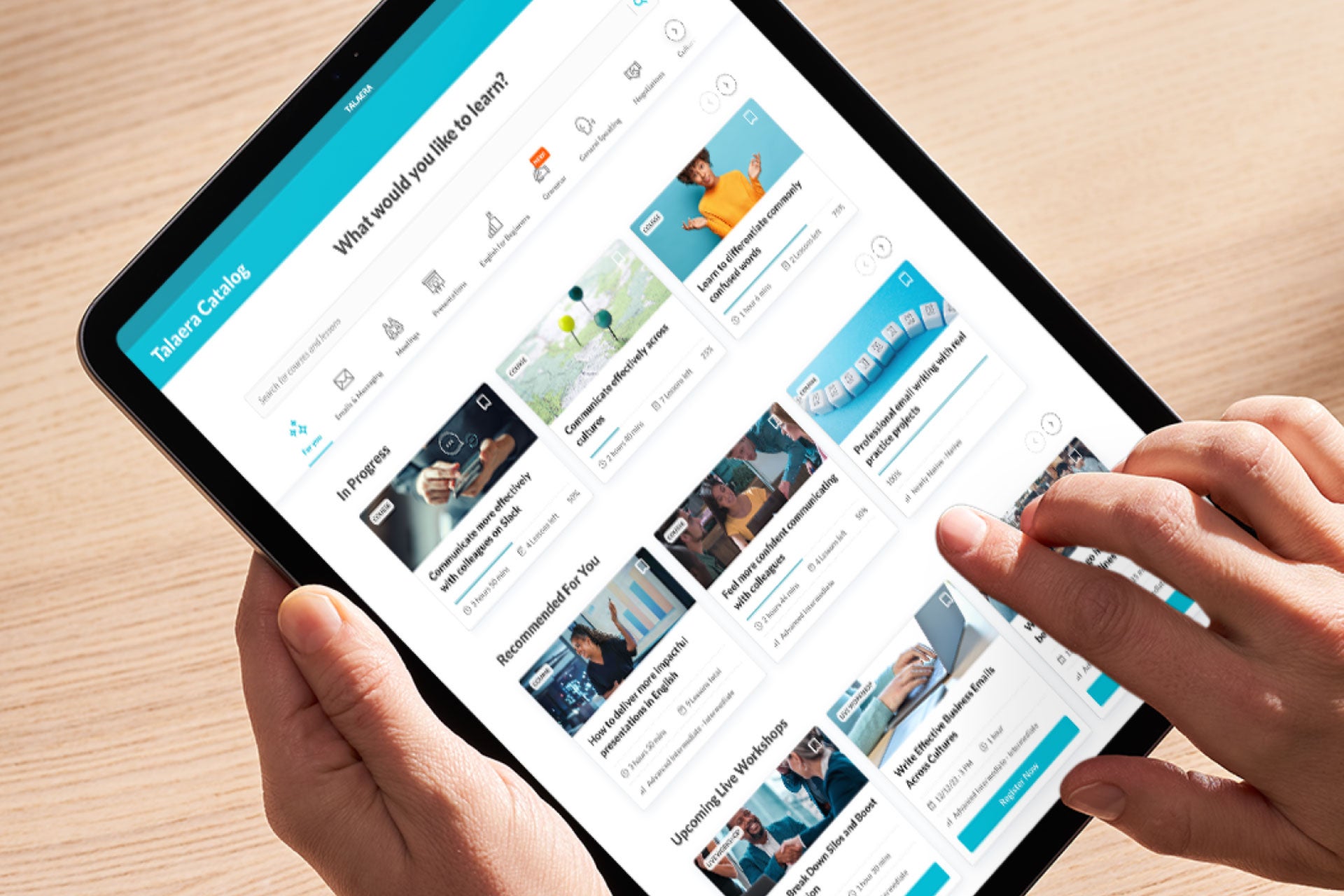 A tablet showing the Talaera language learning platform with eLearning courses for Business English