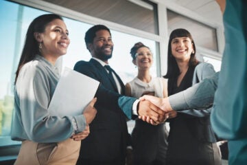 Business professionals shaking hands
