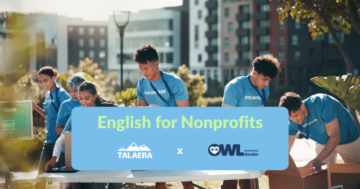 People in blue "Volunteer" shirts pack items in boxes outdoors. Text: "English for Nonprofits," with TALAERA and OWL logos. City backdrop.
