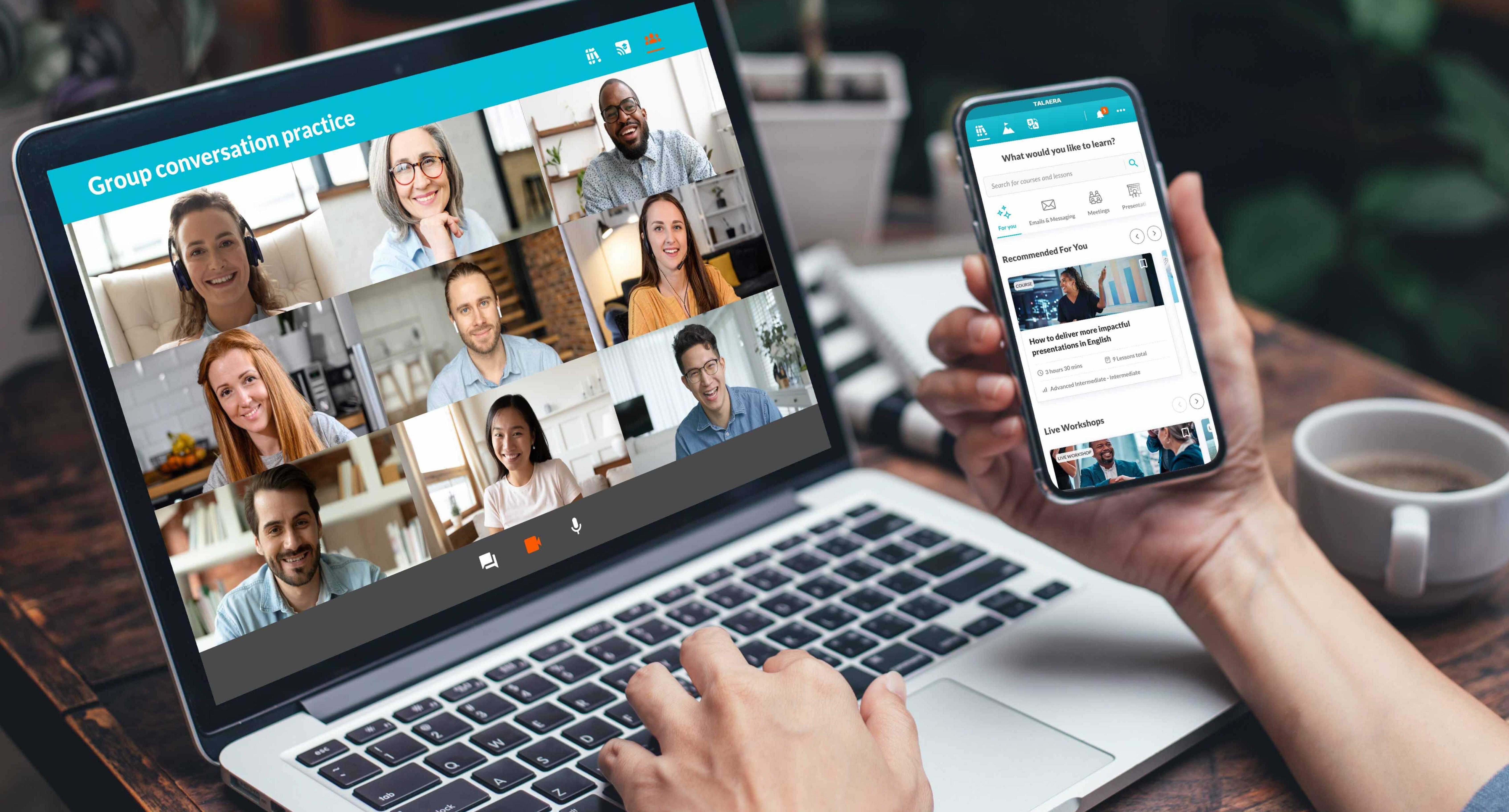 Laptop showing video call with nine smiling people titled "Group conversation practice." Hand holds phone, open app. Cozy setting. Talaera training.